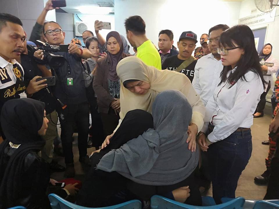 Housing and Local Government Minister Zuraida Kamaruddin consoling family members of the fallen heroes
